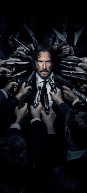 Man surrounded by guns