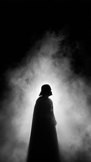 Hooded silhouette in smoke